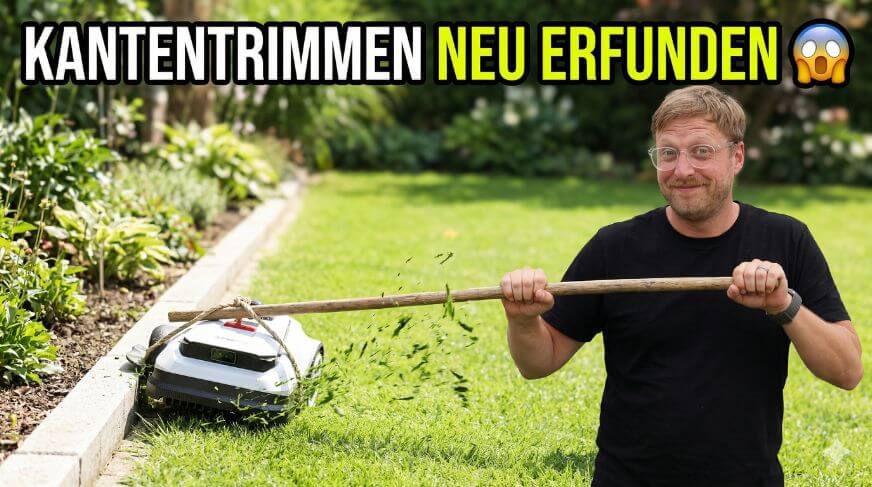 ECOVACS GOAT O1200 LiDAR PRO Mähroboter samt TruEdge Trimmer ist an einen Stock gebunden und der Smart-Home-Fox Tester nutzt das Gerät als Randtrimmer